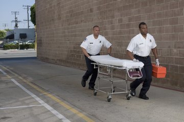 Pair of EMTs with gurney Pair of EMTs with gurney