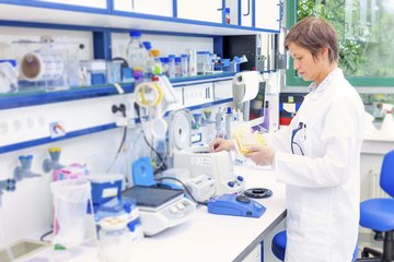 A technician working in a science lab. A technician working in a science lab.