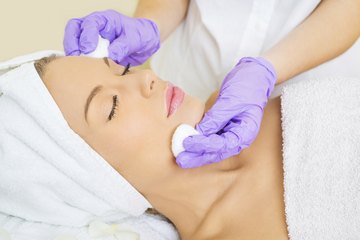 Woman receiving skin-care treatment Woman receiving skin-care treatment