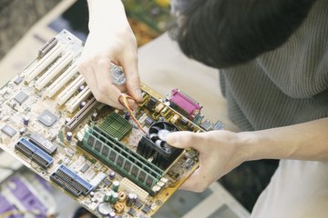 Man working on computer parts Man working on computer parts