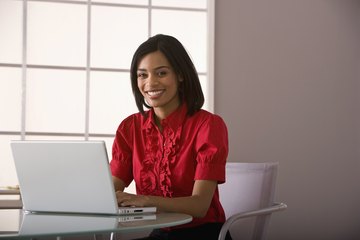 Woman working in front of computer Woman working in front of computer