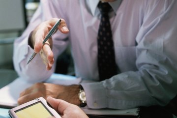 An accounting manager has a discussion with an employee. An accounting manager has a discussion with an employee.