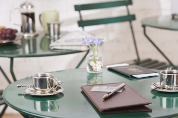 A restaurant tab sits on a table. A restaurant tab sits on a table.