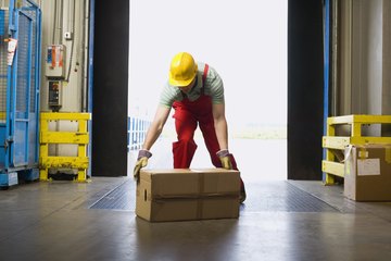 warehouse worker lifting box warehouse worker lifting box