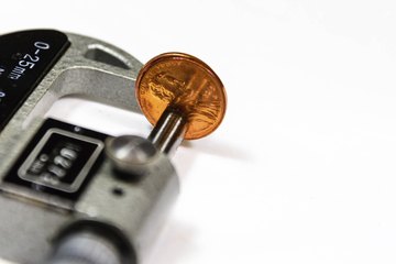 A micrometer gauge. A micrometer gauge.
