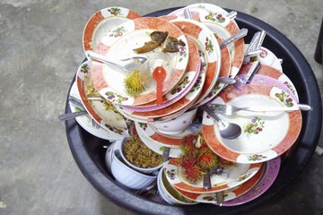 A restaurant try filled with dirty dishes. A restaurant try filled with dirty dishes.