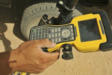 Man marking location on a GPS Man marking location on a GPS
