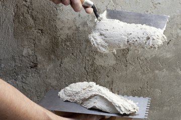 Using mason squares to handle mortar Using mason squares to handle mortar