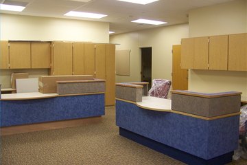 School secretaries greet visitors as they enter the school office. School secretaries greet visitors as they enter the school office.