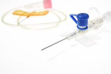 A needle and catheter are used to administer an epidural. A needle and catheter are used to administer an epidural.