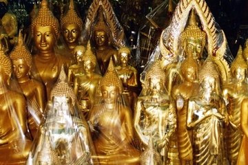 The many highly decorated Buddhist temples continue to attract tourists to Thailand. The many highly decorated Buddhist temples continue to attract tourists to Thailand.