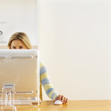 Front view of young woman working on computer