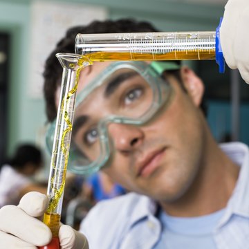 Student performing lab experiment