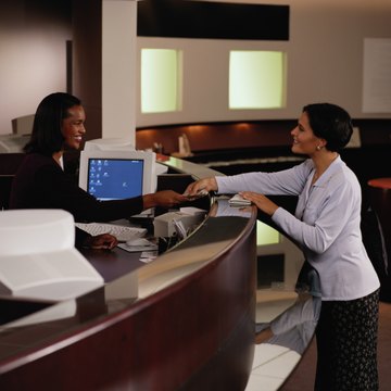 Teller Handing Woman Money at a Bank