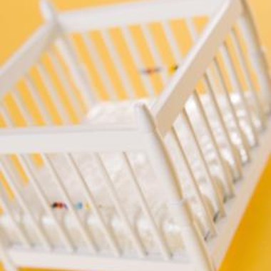 BananaStock/BananaStock/Getty Images Reuse the parts of a drop-side baby crib for an attractive bench.