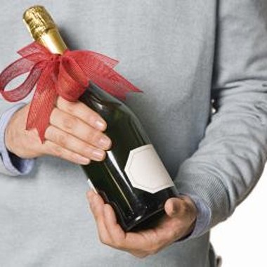 Jupiterimages/Brand X Pictures/Getty Images Alcohol is a suitable door prize for most types of parties.