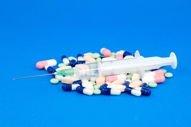medicine image by dinostock from Fotolia.com Pharmacy technicians may verify prescription information, count tablets, label bottles, mix medication and prepare sterile solutions.