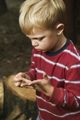 Jupiterimages/Comstock/Getty Images In the poem “The Gift,” Li-Young Lee writes, "Watch as I lift the splinter out. I was seven when my father took my hand like this."