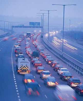 Digital Vision./Photodisc/Getty Images Carbon-emitting vehicles cause dangerous levels of air pollution, especially in densely populated cities.