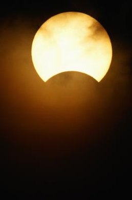 David De Lossy/Digital Vision/Getty Images The Tinguians believed that the sun threw a handful of sand into the moon's face during an argument.