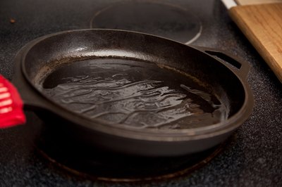 Olive oil simmering in cast-iron skillet.