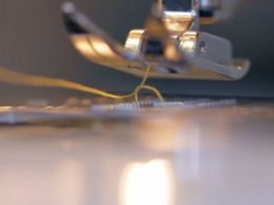 Pick up bobbin thread and start sewing.