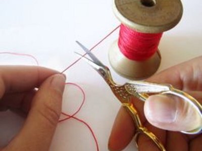 Cut a length of thread.