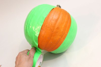 Cover the pumpkin with duck tape