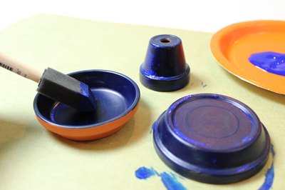 Paint the saucers and smallest pot