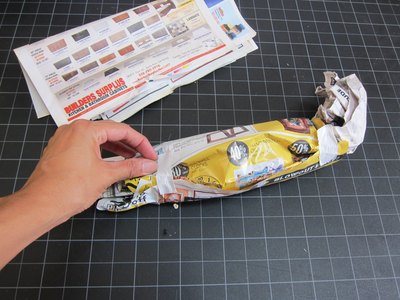 Make a roll out of newspaper.