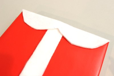 Glue on a white felt collar.