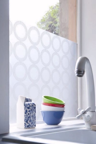 Window film adds peel-and-stick privacy if curtains aren't an option.