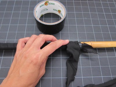 Wrap rod with black ribbon.
