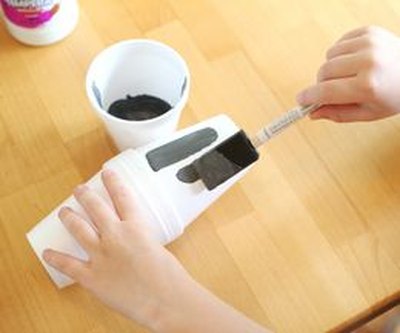 Apply gray paint to the cups using a sponge brush.
