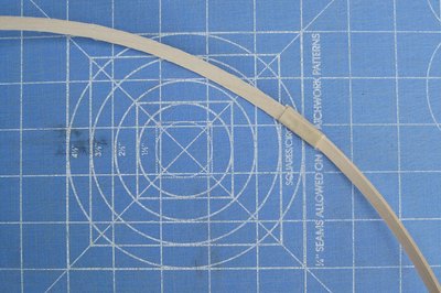 Tape the wooden hoop.