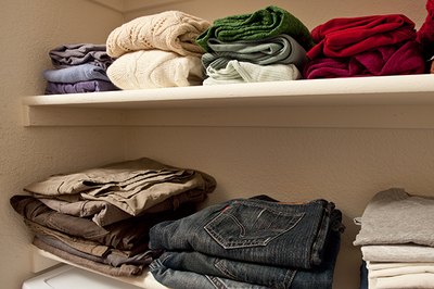 Stack clothing items and organize them by color on your new shelves.