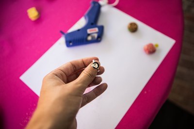 Glue the trinket to the ring base.