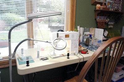 Natural lighting and a magnifier are valuable assets by the machine.