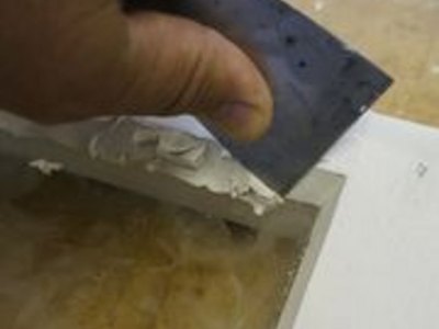Laying down a crisp bevel in glazing compound.