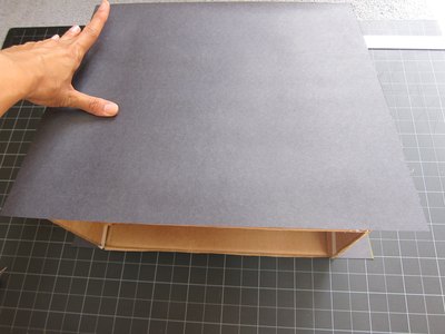 Add paper to box.