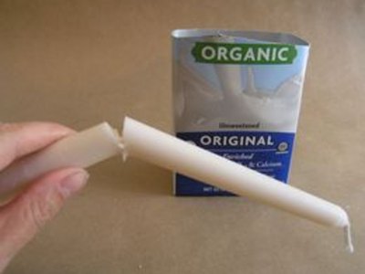 Break candle so that it is a little shorter than the milk carton.