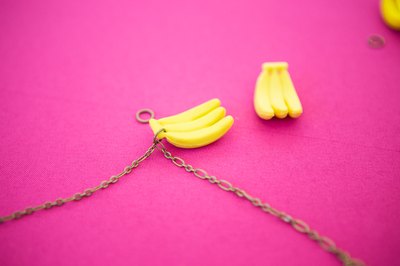Attach the trinkets to the chain and space them out evenly.