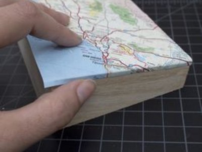 Fold paper over edge.