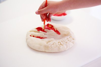 Paint the handprint once clay is dry.
