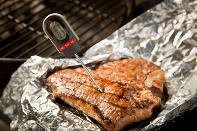 T-Bone steak with meat thermometer.