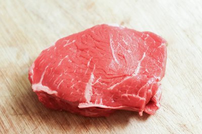 Raw top sirloin steak.
