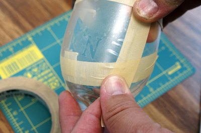Protect the area beyond the stencil with masking tape.