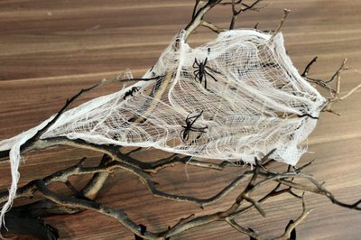 Make a cobweb out of cheesecloth