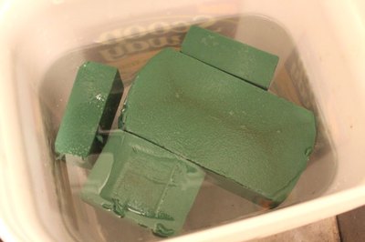 Soak the floral foam in water
