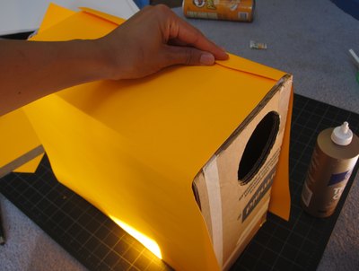 Glue paper to the box.